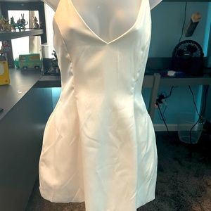 Akira mini dress in a white satin like material